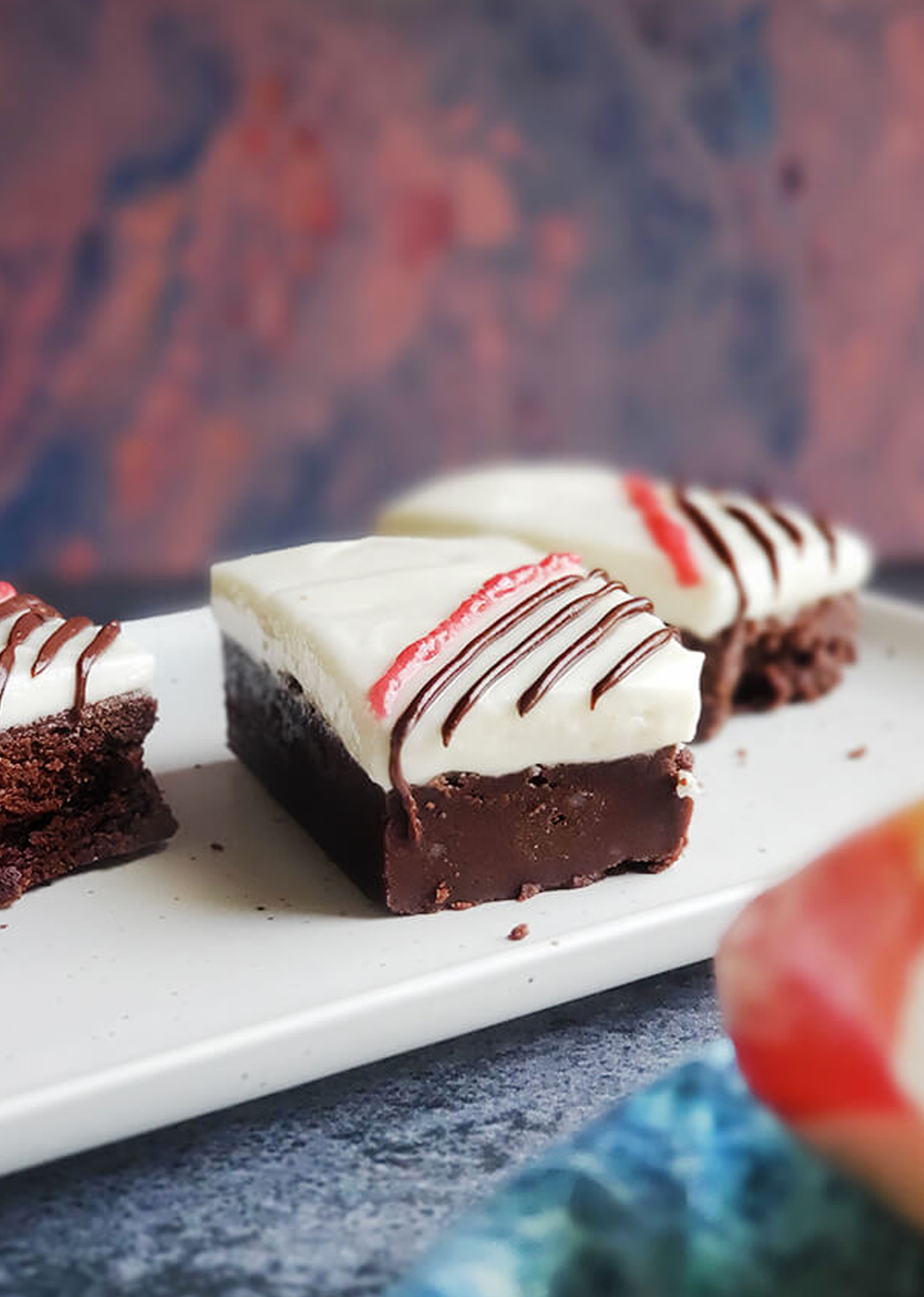 Goat Cheese Brownies with a Dark Chocolate and Raspberry Drizzle